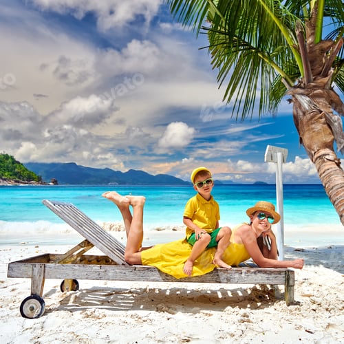 Preview: Family On Beautiful Petite Anse Beach, Mother With Three Year Old Toddler Boy On Sun Bed. Summer