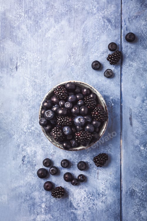 Preview: Organic Blueberry and blackberry berries, freshly picked in garden