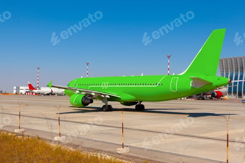 Preview: Green passenger airplane at the airport on sunny day