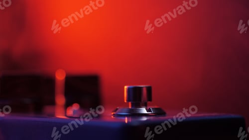 Preview: Extremely close up of button for effect electro guitar pedal
