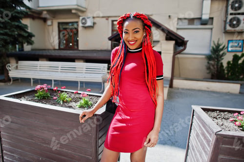 Preview: African american girl in red dress with dreadlocks
