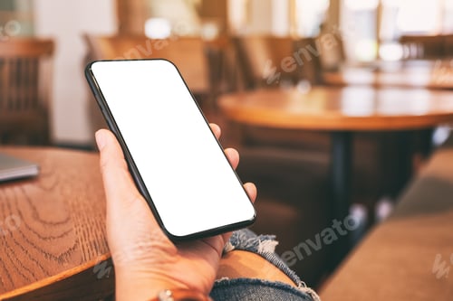 Preview: Hand holding black mobile phone with blank desktop screen