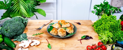 Preview: Baked chicken and turkey cutlets or meatballs with yellow paprika on kitchen table.
