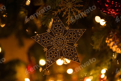 Preview: Christmas tree toy golden star close-up.
