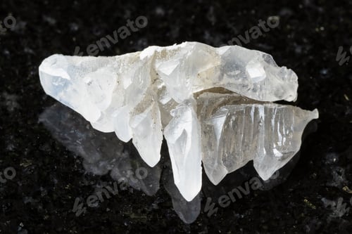 Preview: sample of raw salammoniac mineral on black granite