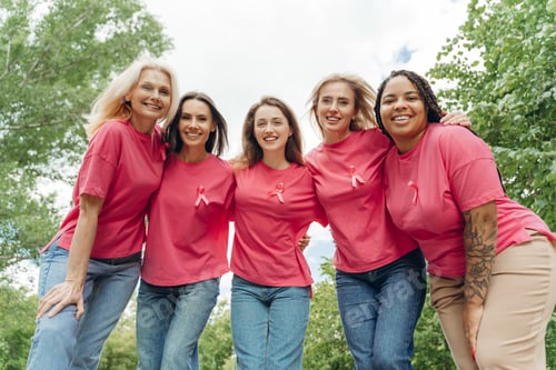 Preview: Multiethnic women wearing pink ribbons are embracing for breast cancer awareness