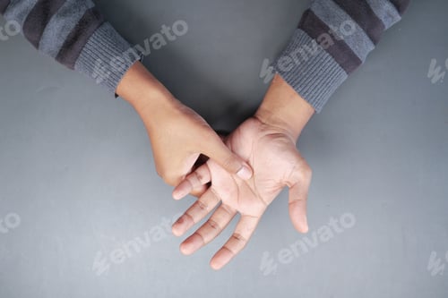 Preview: man suffering pain in hand top view