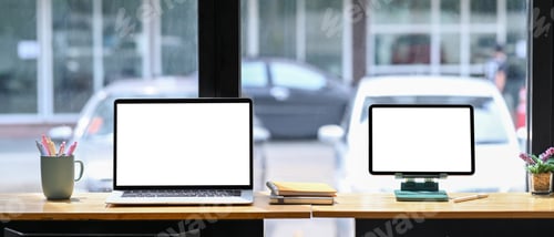 Preview: Front view laptop computer and digital tablet on wooden table.