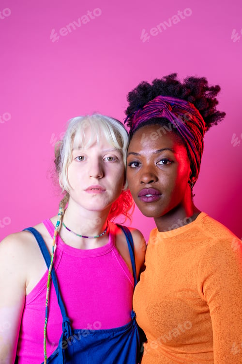 Preview: Isolated caucasian and black woman posing together for inclusion and tolerance