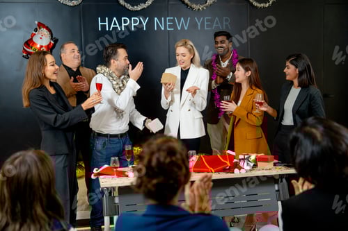 Preview: Caucasian manager make surprise by giving the present or gift to his staff on stage during new year