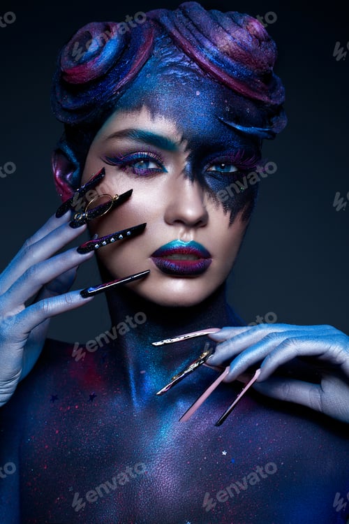 Preview: Beautiful girl with art fashion make up, creative hairstyle, long nails. Design manicure.