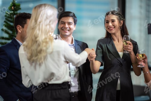 Preview: A group of working people are hanging out celebrating and check hand