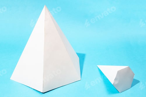 Preview: big standing and little lying pyramids on blue