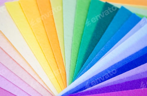 Preview: Close-up of felt fabric sheets stacked on top of each other in the colors of the rainbow spectrum