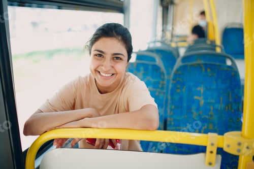 Preview: Smiling Woman Rides on Bus Using Yellow Rail