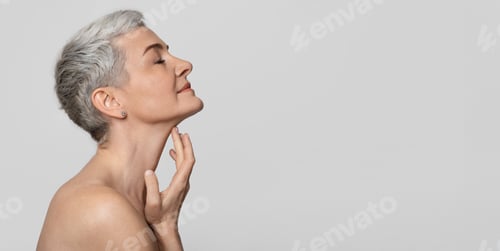 Preview: Anti-Age Treatment. Beautiful middle-aged woman touching soft skin on her neck