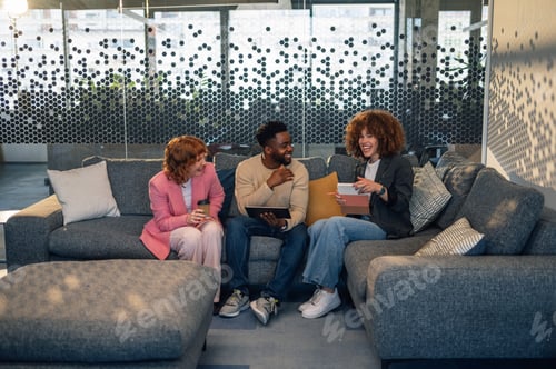 Preview: Interracial businesspeople with tablet collaborating on start up project