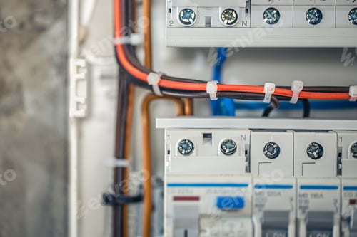 Preview: Close up circuit breakers and wire in control panel.