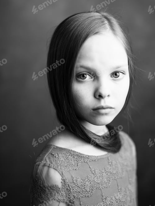 Preview: Beautiful little girl portrait close-up cropped view in dark background model