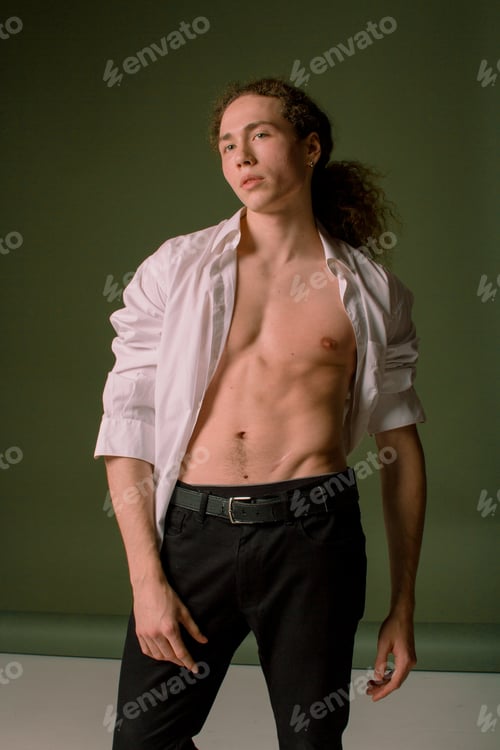 Preview: Attractive And Stylish Guy With Curly Hair And A Sports Figure