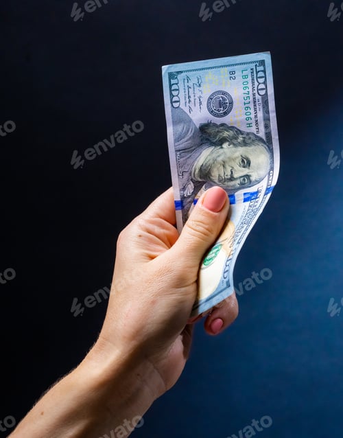 Preview: Hand holding banknotes