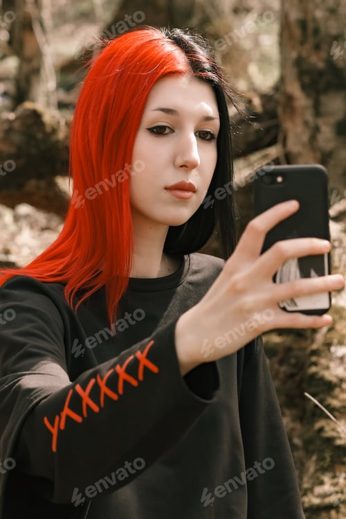 Preview: A young girl with colored hair takes a selfie