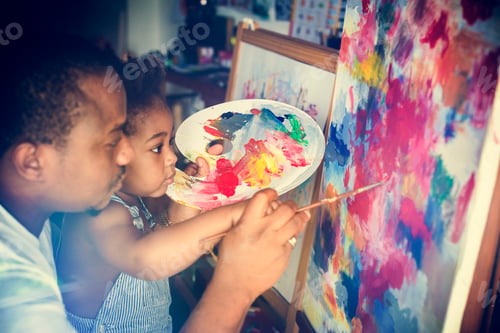 Preview: African descent dad teaching his child how to paint