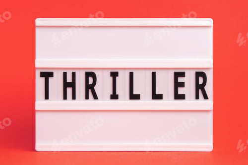 Preview: The word thriller on lightbox isolated red background. Literary Genres