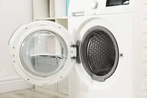 Preview: Modern washing machine in light laundry room