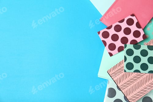 Preview: Flat lay composition with different notebooks on color background. School stationery
