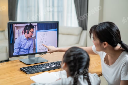 Preview: Asian girl learning online class from teacher by digital remote internet meeting due to covid.