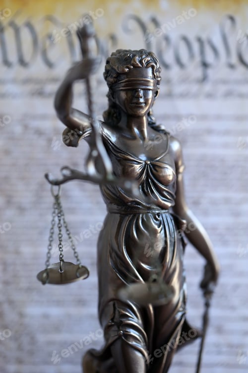 Preview: The statue of justice Themis or Justitia, the blindfolded goddess of justice against US Constitution