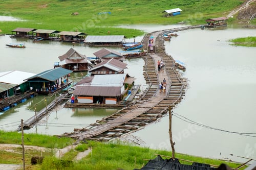Preview: Tourist walking on village antique and wooden bridge traditional culture in dam