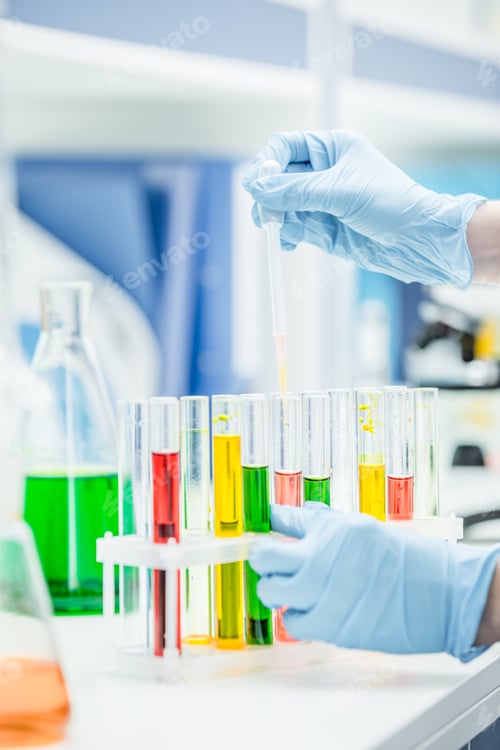 Preview: Close-up partial view of scientist in gloves working with test tubes in laboratory