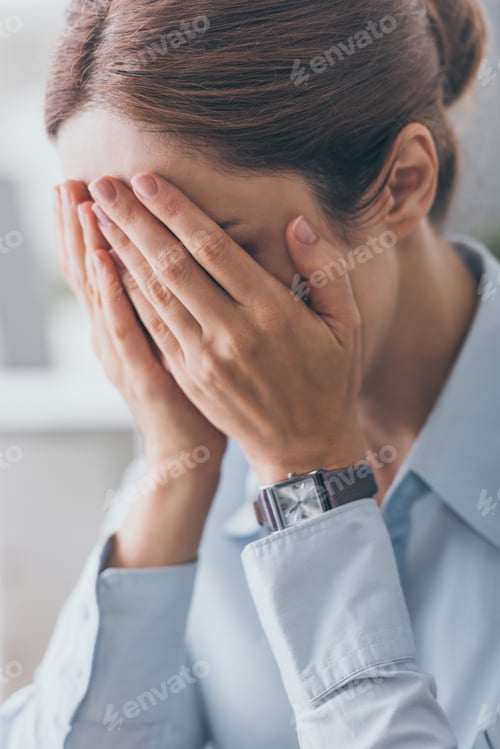 Preview: close-up shot of stressed adult businesswoman covering face with hands