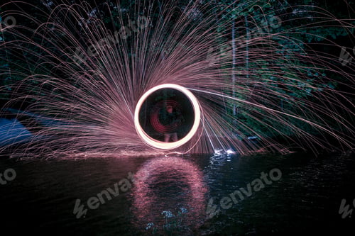 Preview: Shot of man with bengal lights on a long exposure