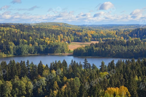 Preview: Panorama: forests, lake, colorful trees, clouds in Finland.