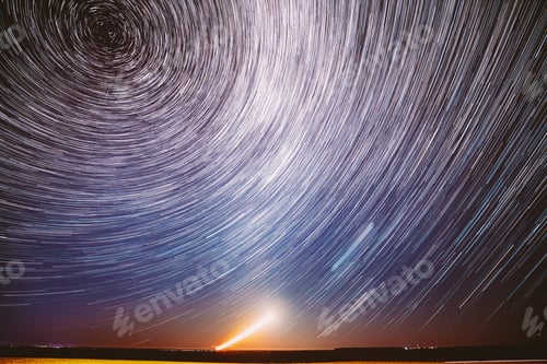 Preview: Moonrise Sky Natural Background. Unusual Amazing Stars Effect In Sky. Trace Of Moon. Spin Of Star