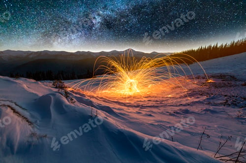 Preview: Light painting art. Spinning steel wool in abstract circle, firework