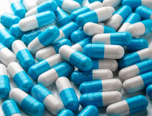 Capsules Scattered on a White Background