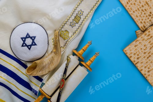 Preview: Passover day traditional celebration with kosher matzah unleavened bread on torah scroll of Jewish