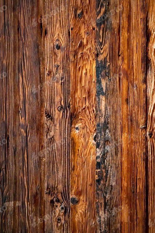 Preview: Closeup view of a wooden surface, showing the texture and grain of the wood.