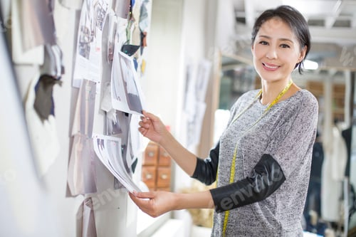 Preview: Fashion designer working in studio