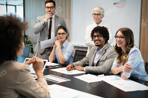 Preview: Group of business people working together, brainstorming in office
