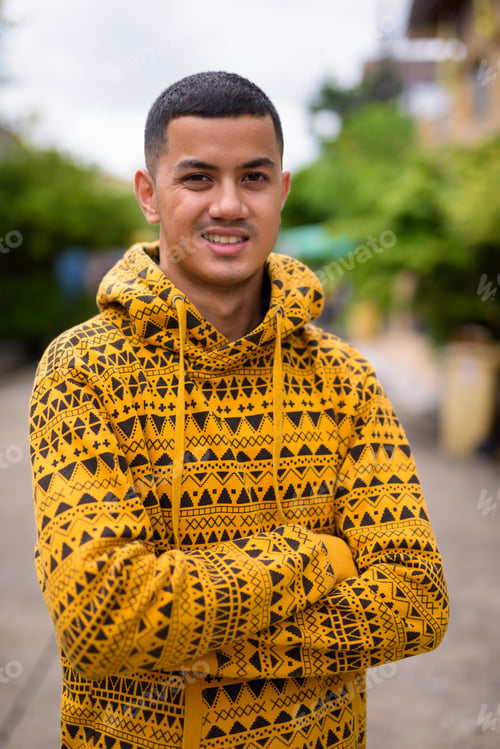 Preview: Young multi-ethnic Asian man in the streets outdoors