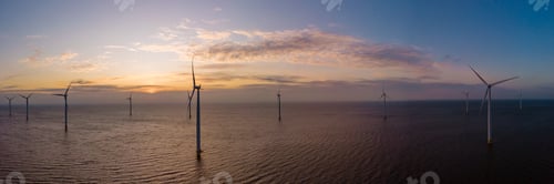 Preview: Windmill park with windmill turbines in the Netherlands at sunset