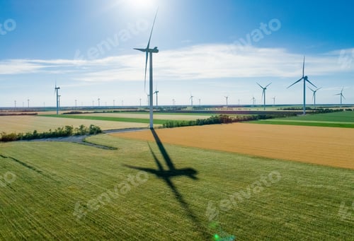 Preview: Group of windmills for electric power production in the agricultural fields. Aerial view.