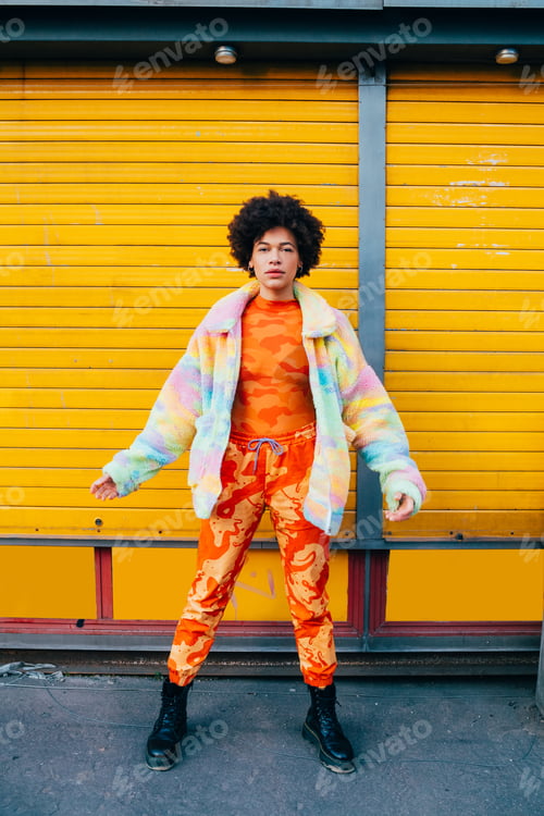 Preview: Confident stylish young black woman posing outdoor cool outfit looking camera smiling