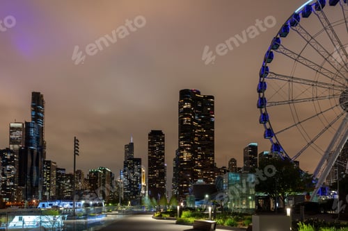 Preview: Chicago city high rise buildings illuminated and Centennial Wheel at Navy Pier. Illinois USA