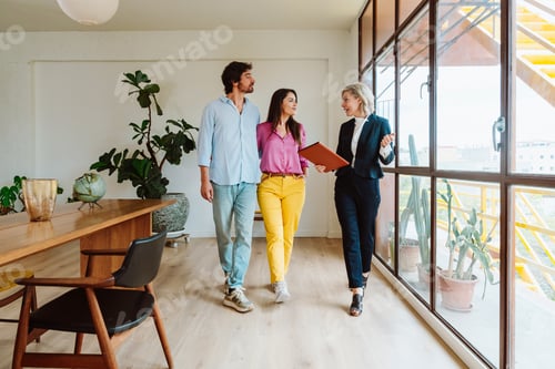 Preview: Real estate agent showing an apartment to a couple.